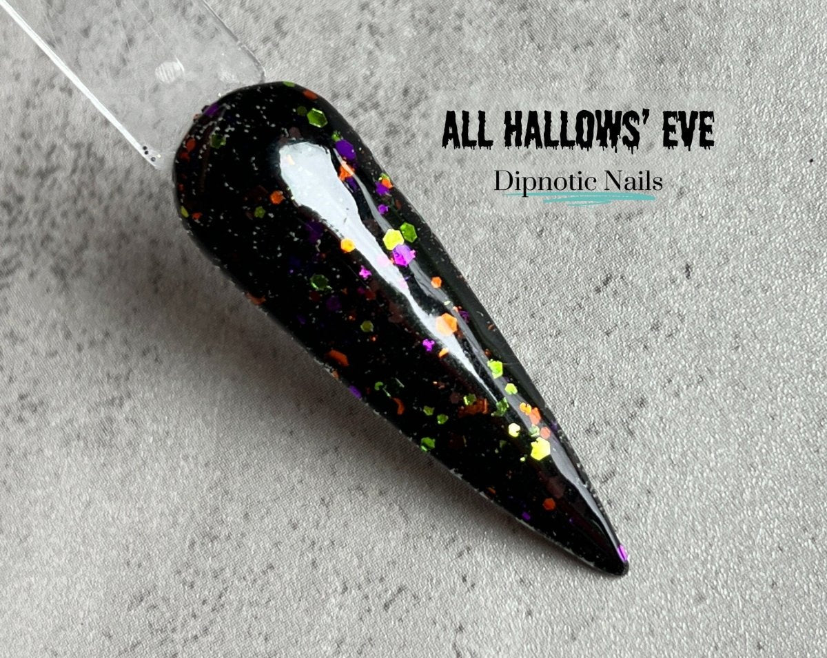 Photo shows swatch of Dipnotic Nails All Hallows' Eve Black, Orange, Purple, and Green Glitter Nail Dip Powder Halloween 2023 Collection