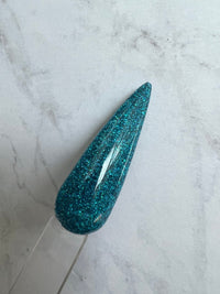 Photo shows swatch of Dipnotic Nails Aloha Blue Holographic Nail Dip Powder The Hello Holo Collection