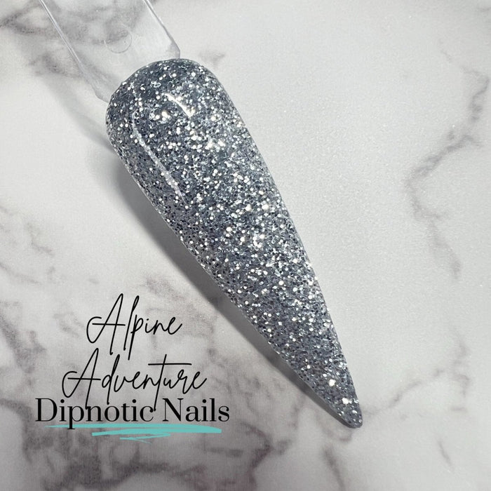 Photo shows swatch of Dipnotic Nails Alpine Adventure Satin Silver Glitter Dip Powder The Colorado Winter Collection