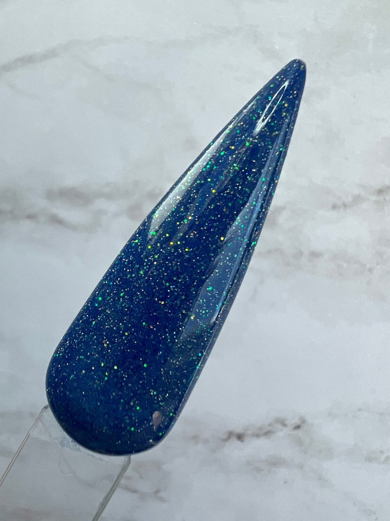 Photo shows swatch of Dipnotic Nails Aquarius Blue Nail Dip Powder Stardust Collection