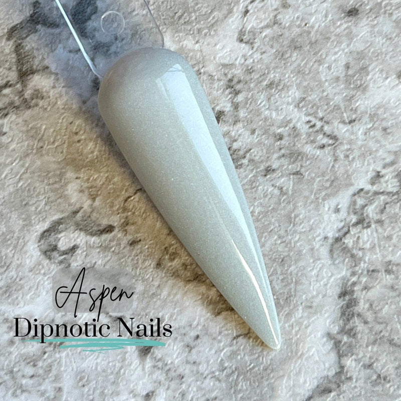 Photo shows swatch of Dipnotic Nails Aspen Light Grey Dip Powder The Colorado Winter Collection