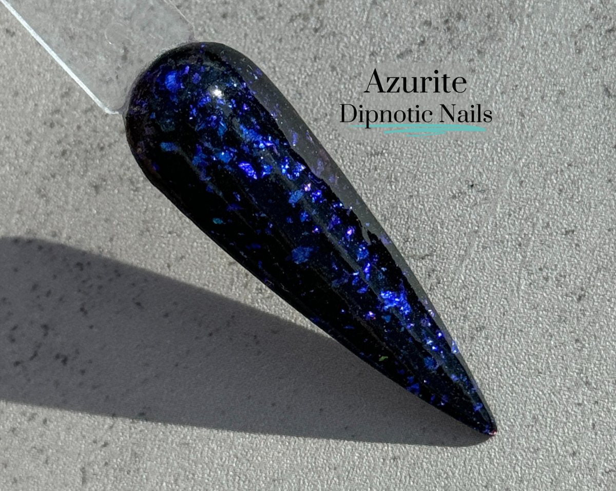 Photo shows swatch of Dipnotic Nails Azurite Black and Blue Nail Dip Powder