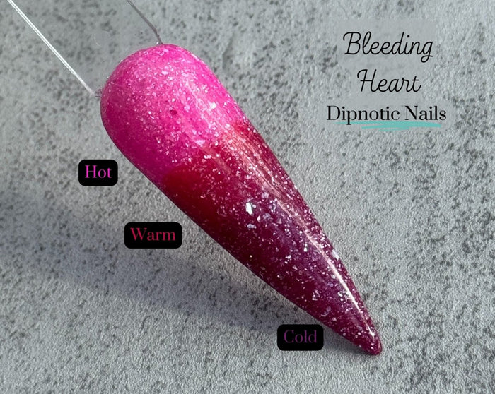 Photo shows swatch of Dipnotic Nails Bleeding Heart Triple Thermal Nail Dip Powder