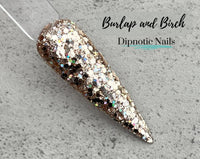 Photo shows swatch of Dipnotic Nails Burlap and Birch Pale Gold and Silver Nail Dip Powder Burlap and Boughs Collection
