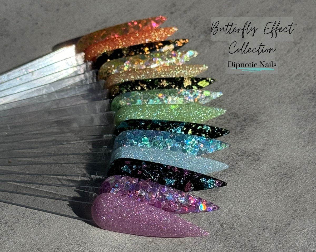 Photo shows swatch of Dipnotic Nails Butterfly Effect Black, Green, and Blue Foil Nail Dip Powder The Butterfly Effect Collection