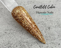 Photo shows swatch of Dipnotic Nails Candlelit Cabin Gold Nail Dip Powder Burlap and Boughs Collection