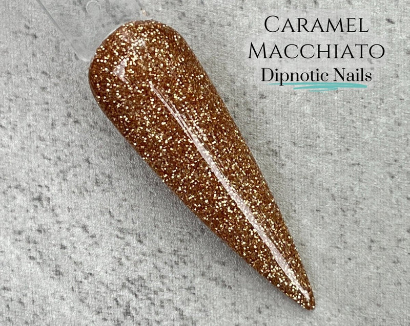 Photo shows swatch of Dipnotic Nails Caramel Macchiato Golden Brown Nail Dip Powder Coffee Bar Dip Powder Collection