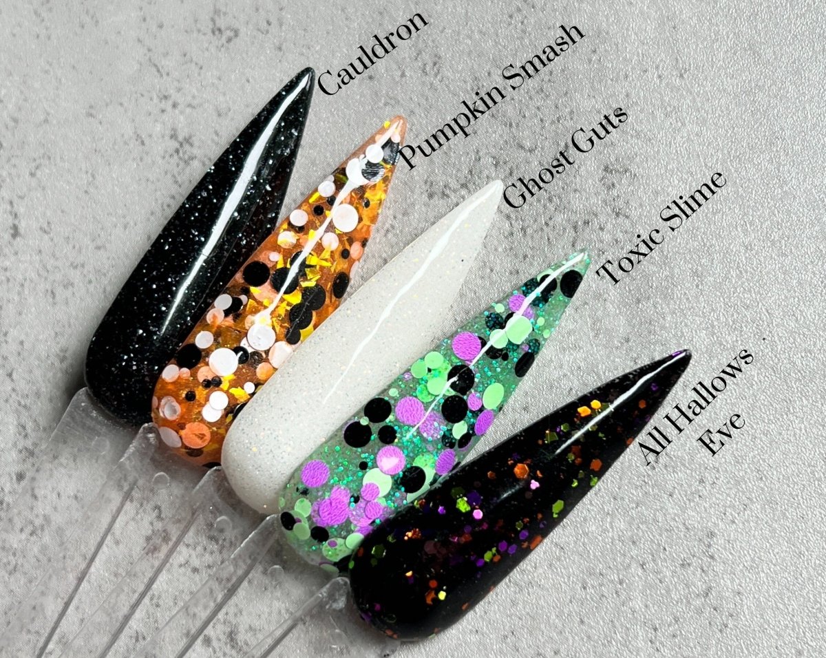 Photo shows swatch of Dipnotic Nails Cauldron Black and Silver Glitter Nail Dip Powder Halloween 2023 Collection