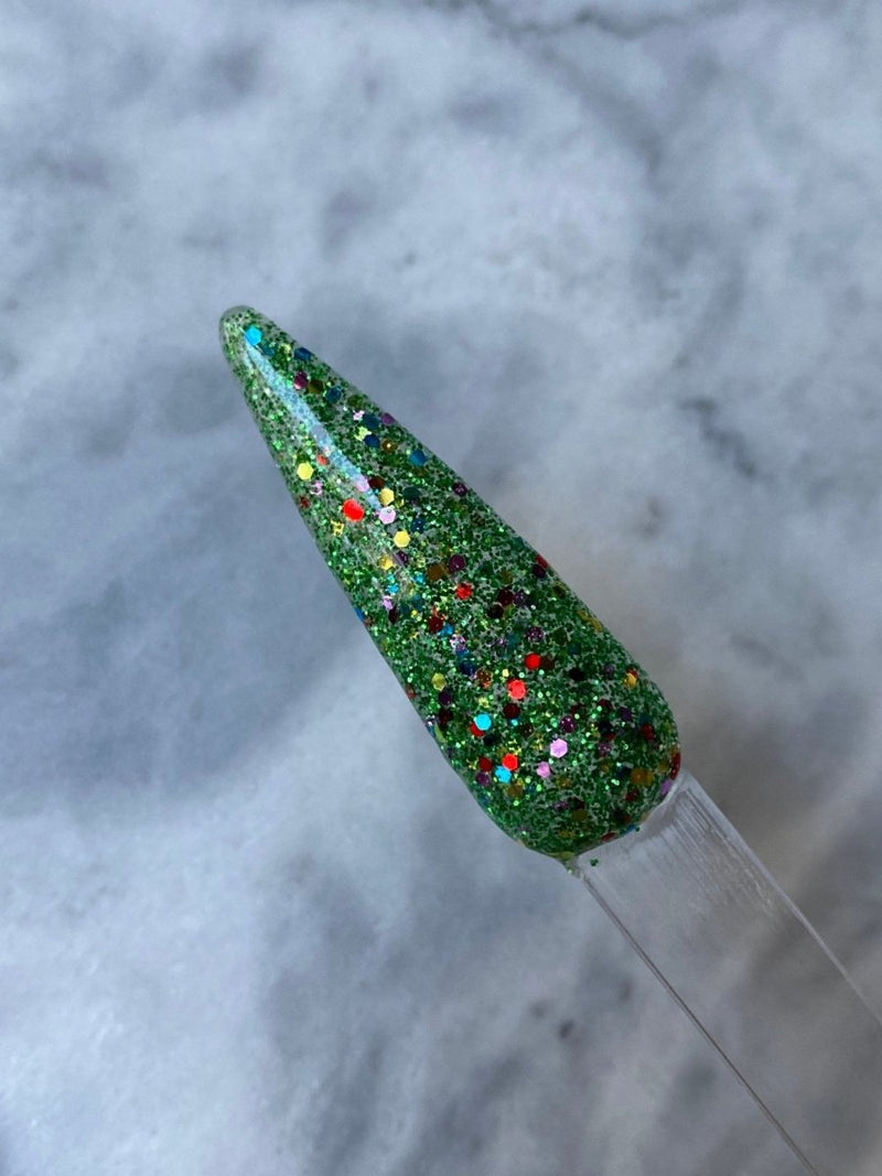 Photo shows swatch of Dipnotic Nails Christmas Tree Green Christmas Nail Dip Powder
