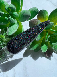 Photo shows swatch of Dipnotic Nails Ciao Black Holographic Nail Dip Powder The Hello Holo Collection