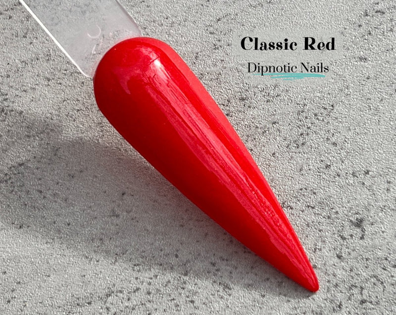 Photo shows swatch of Dipnotic Nails Classic Red Red Nail Dip Powder The Christmas Brights Collection