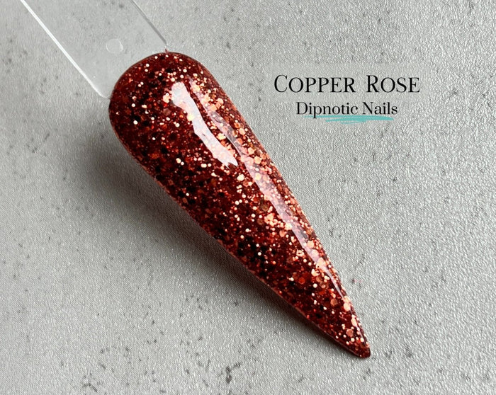Photo shows swatch of Dipnotic Nails Copper Rose- Rosy Copper Nail Dip Powder Copper Rose Collection