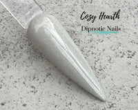 Photo shows swatch of Dipnotic Nails Cozy Hearth Grey Nail Dip Powder Burlap and Boughs Collection