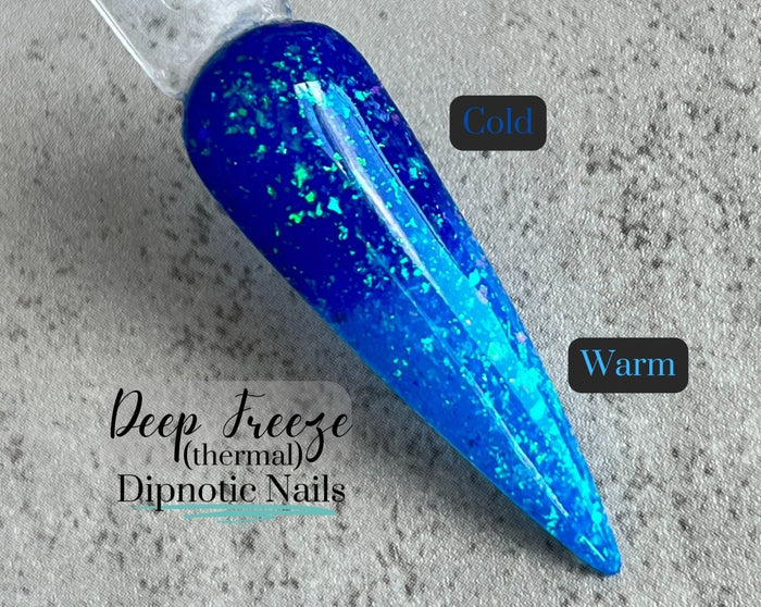 Photo shows swatch of Dipnotic Nails Deep Freeze Dark Blue to Light Blue Flaky Thermal Nail Dip Powder The Frozen Fairy Collection