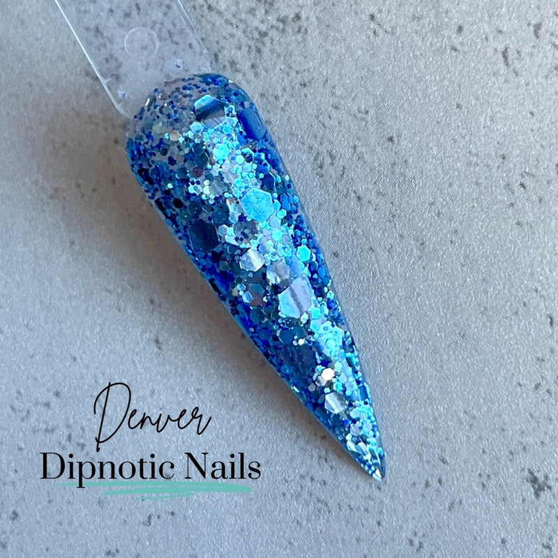 Photo shows swatch of Dipnotic Nails Denver Dusty Blue Dip Powder The Colorado Winter Collection