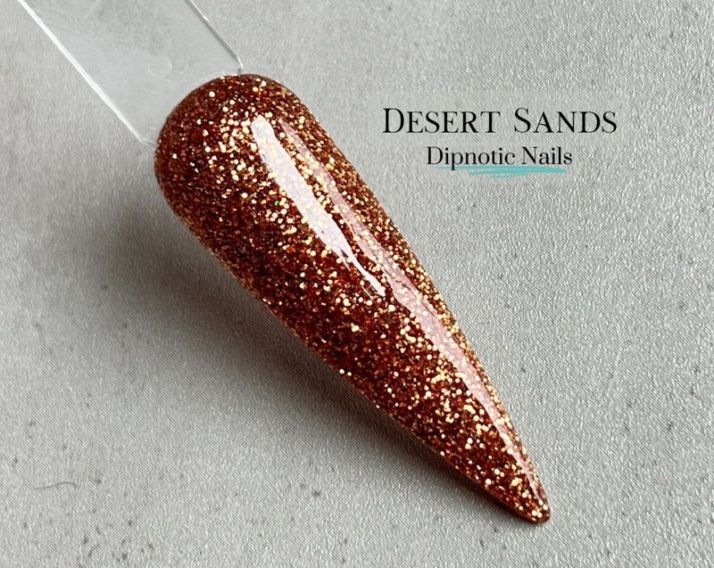 Photo shows swatch of Dipnotic Nails Desert Sands Copper Nail Dip Powder Copper Rose Collection