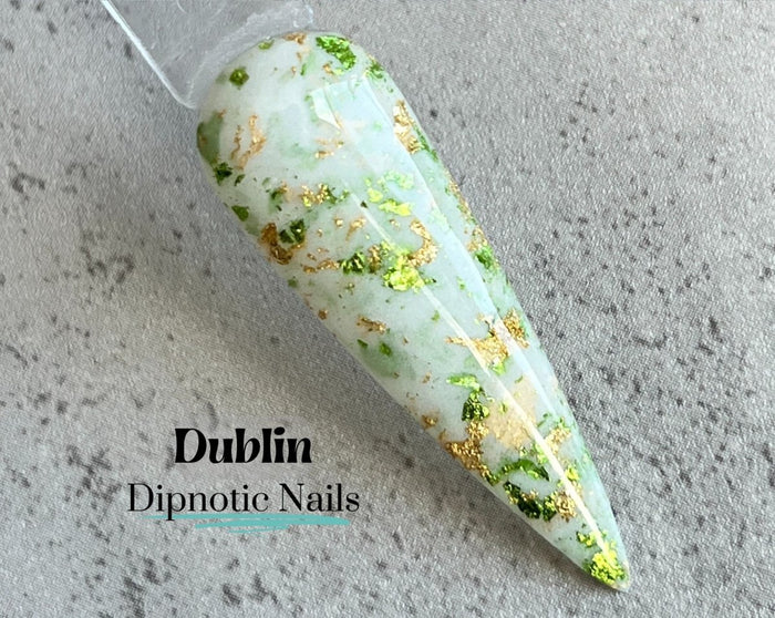 Photo shows swatch of Dipnotic Nails Dublin White, Green, and Gold Foil Nail Dip Powder The Irish for a Day Collection