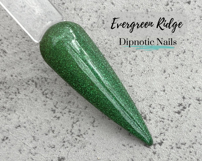 Photo shows swatch of Dipnotic Nails Evergreen Ridge Green Chameleon Nail Dip Powder Burlap and Boughs Collection