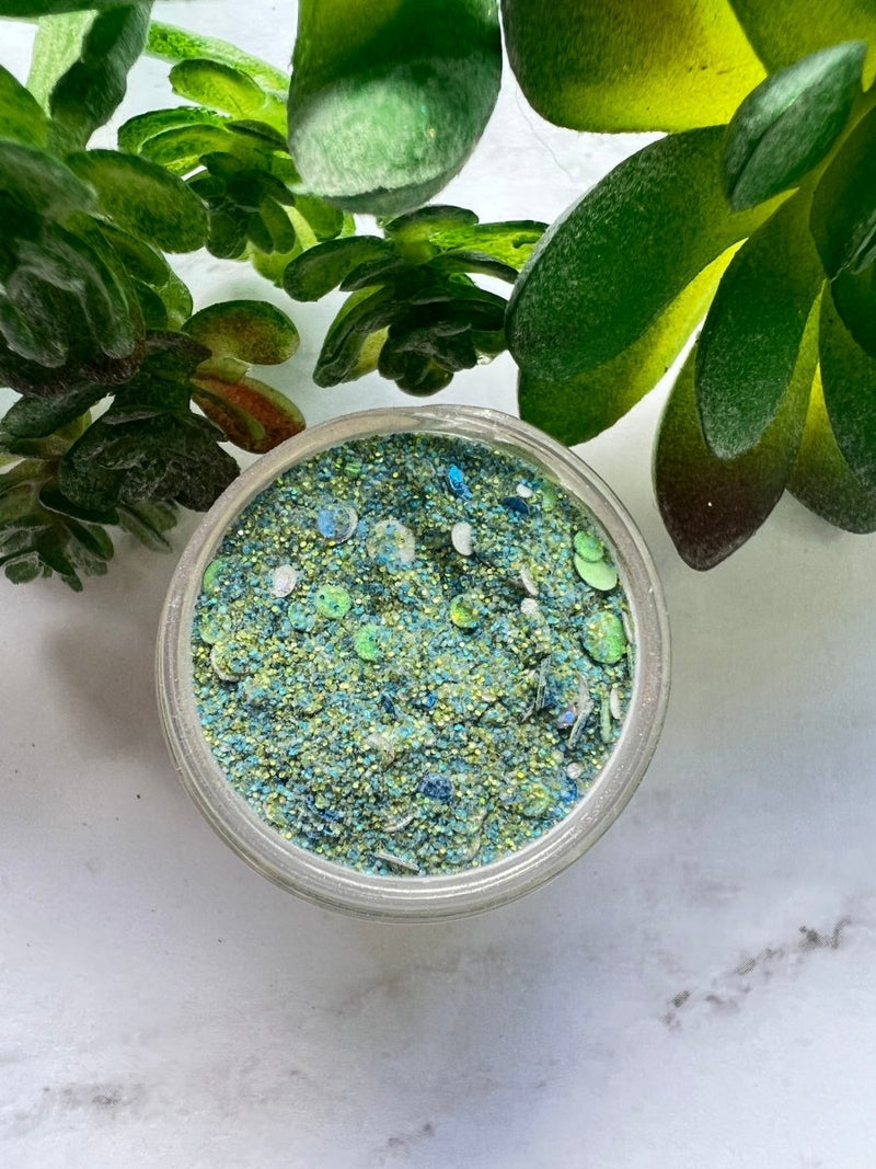 Photo shows swatch of Dipnotic Nails Ferris Wheel Blue, Green, and Silver Dot Glitter Nail Dip Powder The Boardwalk Collection