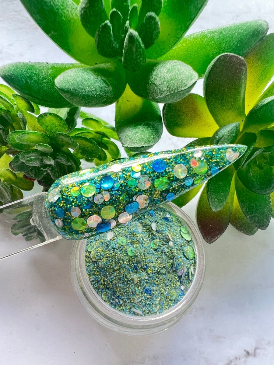 Photo shows swatch of Dipnotic Nails Ferris Wheel Blue, Green, and Silver Dot Glitter Nail Dip Powder The Boardwalk Collection