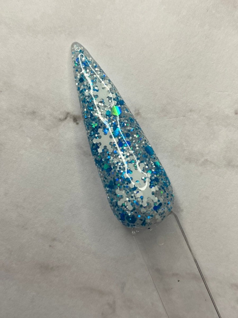 Photo shows swatch of Dipnotic Nails Flurries Blue and White Nail Dip Powder