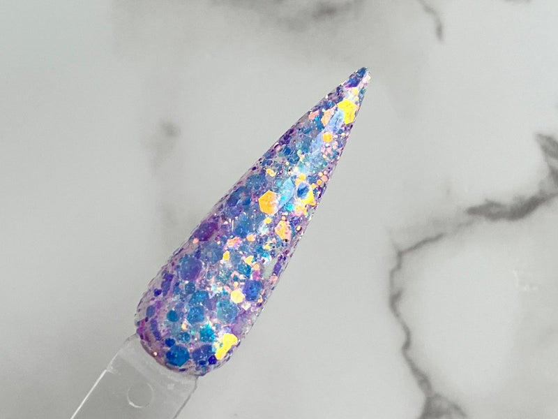Photo shows swatch of Dipnotic Nails Frozen Fairy Dust Purple Nail Dip Powder The Frozen Fairy Collection