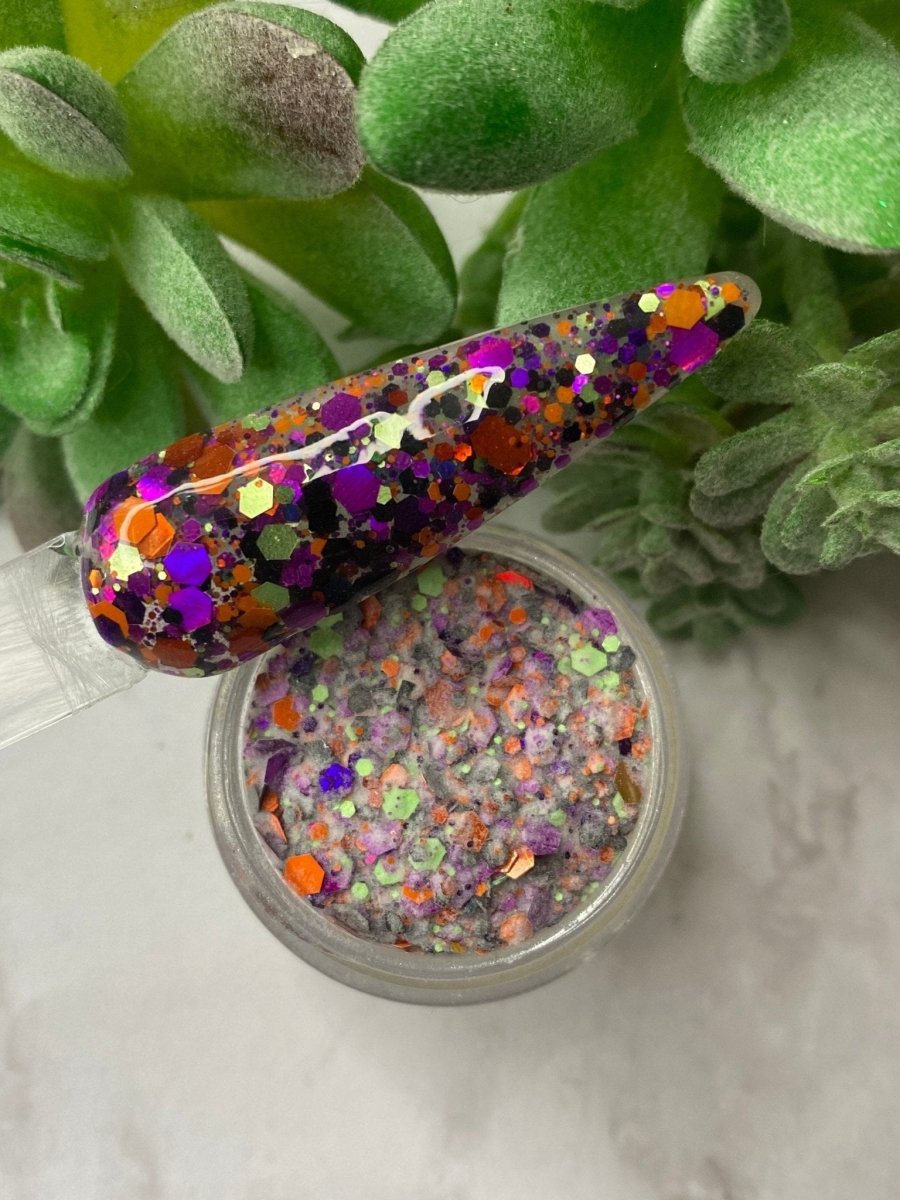 Photo shows swatch of Dipnotic Nails Halloween Glitter Collection Nail Dip Powder