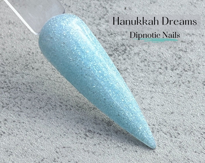 Photo shows swatch of Dipnotic Nails Hanukkah Dreams Light Blue Hanukkah Nail Dip Powder Latkes and Light Collection