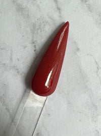 Photo shows swatch of Dipnotic Nails Hot Streak Red Nail Dip Powder The Casino Collection