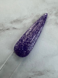 Photo shows swatch of Dipnotic Nails Indulgent Purple Nail Dip Powder