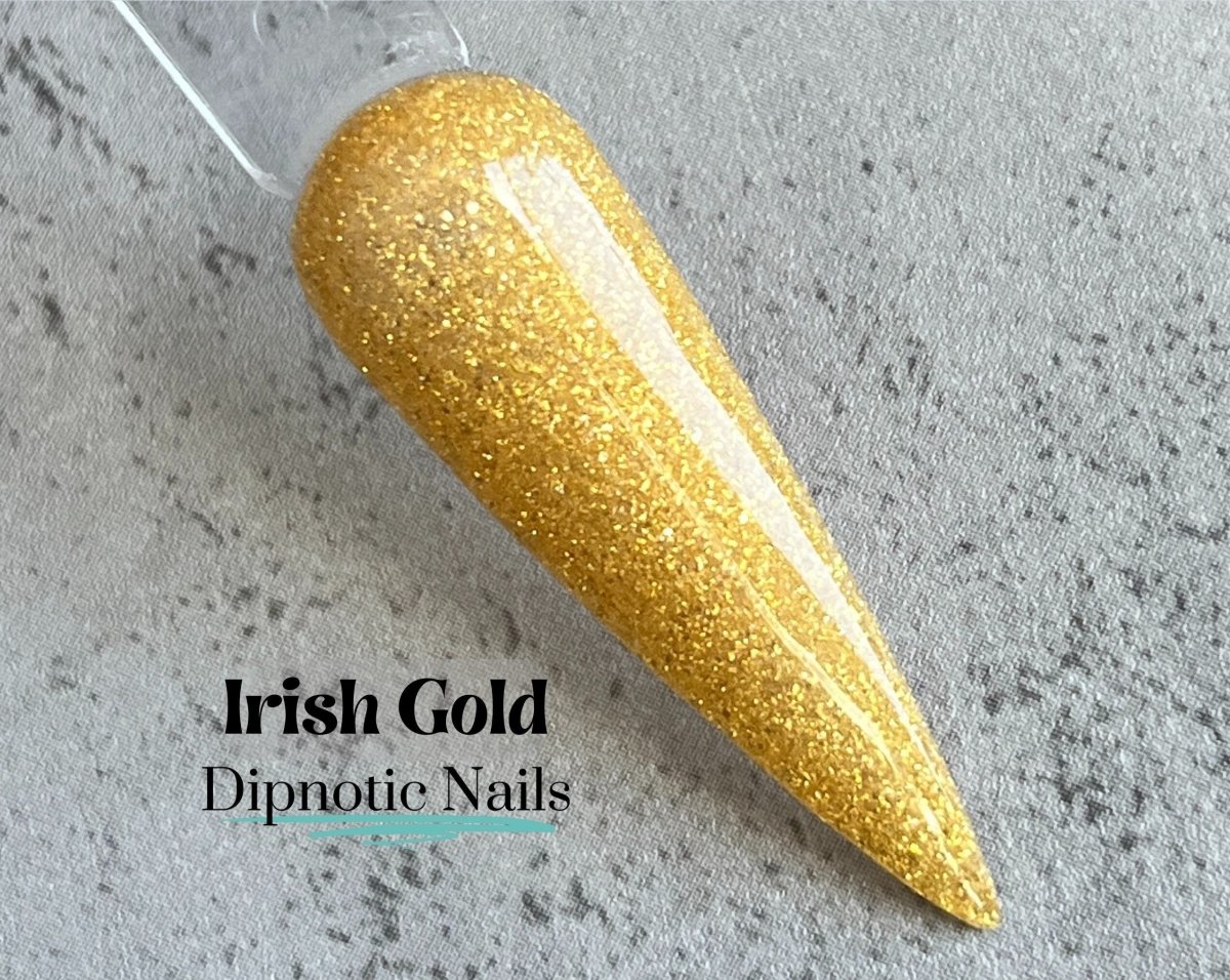 Photo shows swatch of Dipnotic Nails Irish Gold Nail Dip Powder The Irish for a Day Collection