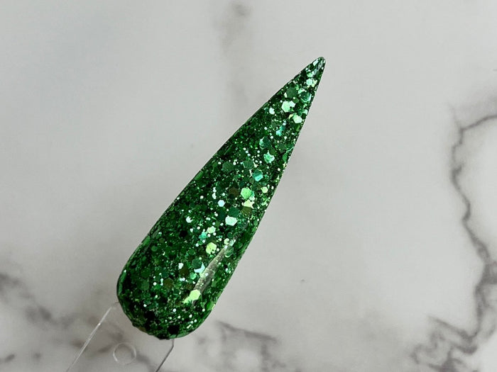 Photo shows swatch of Dipnotic Nails Killarney Green Nail Dip Powder The Emerald Isle Collection