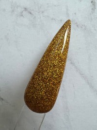 Photo shows swatch of Dipnotic Nails Kon’nichiwa Gold Holographic Nail Dip Powder The Hello Holo Collection