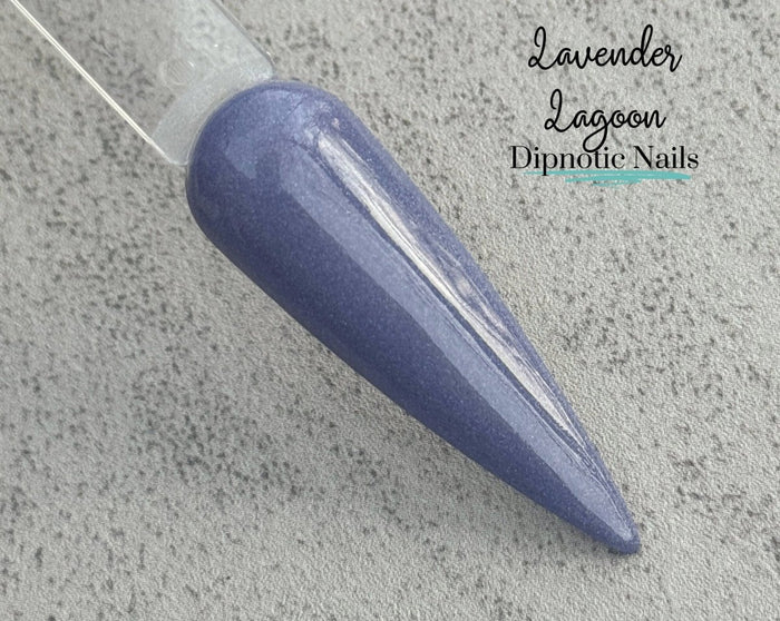 Photo shows swatch of Dipnotic Nails Lavender Lagoon Periwinkle Dip Powder- The Enchanted Waters Collection