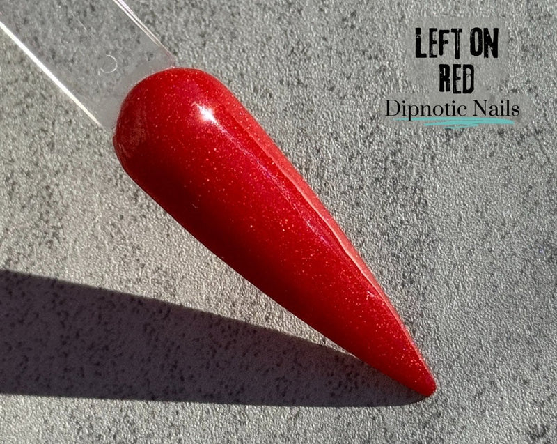 Photo shows swatch of Dipnotic Nails Left on Red- Red Shimmer Nail Dip Powder- The Heartbreaker Collection