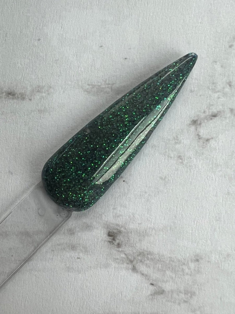Photo shows swatch of Dipnotic Nails Leviathan Green Nail Dip Powder