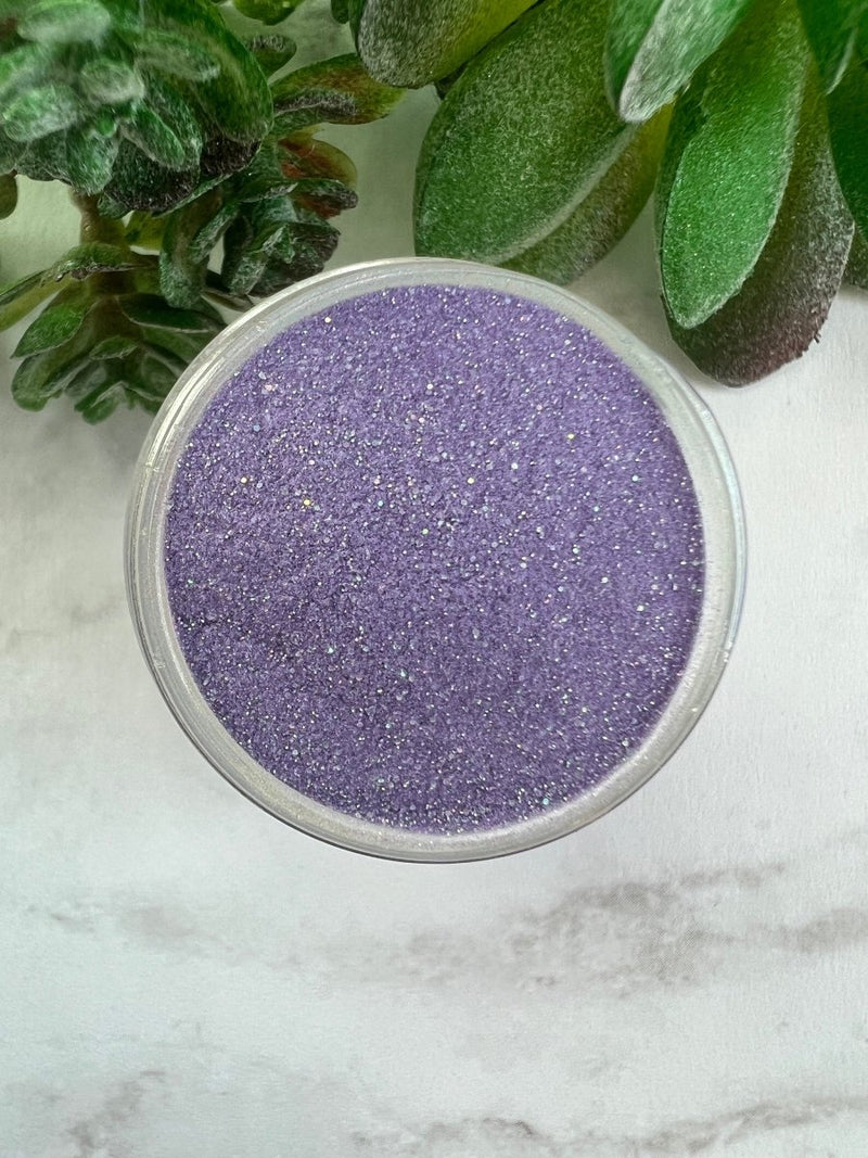 Photo shows swatch of Dipnotic Nails Libra Purple Nail Dip Powder Stardust Collection