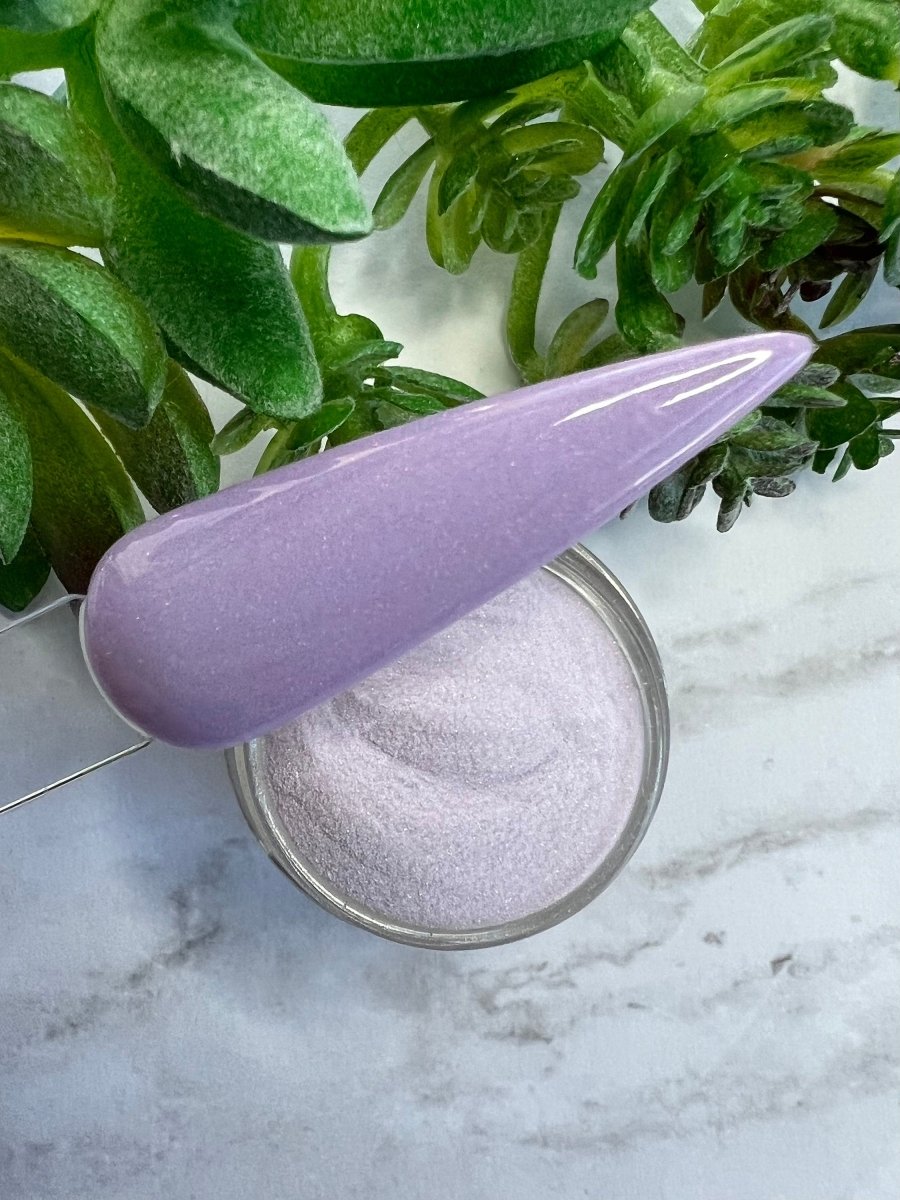 Photo shows swatch of Dipnotic Nails Lilac Purple Nail Dip Powder