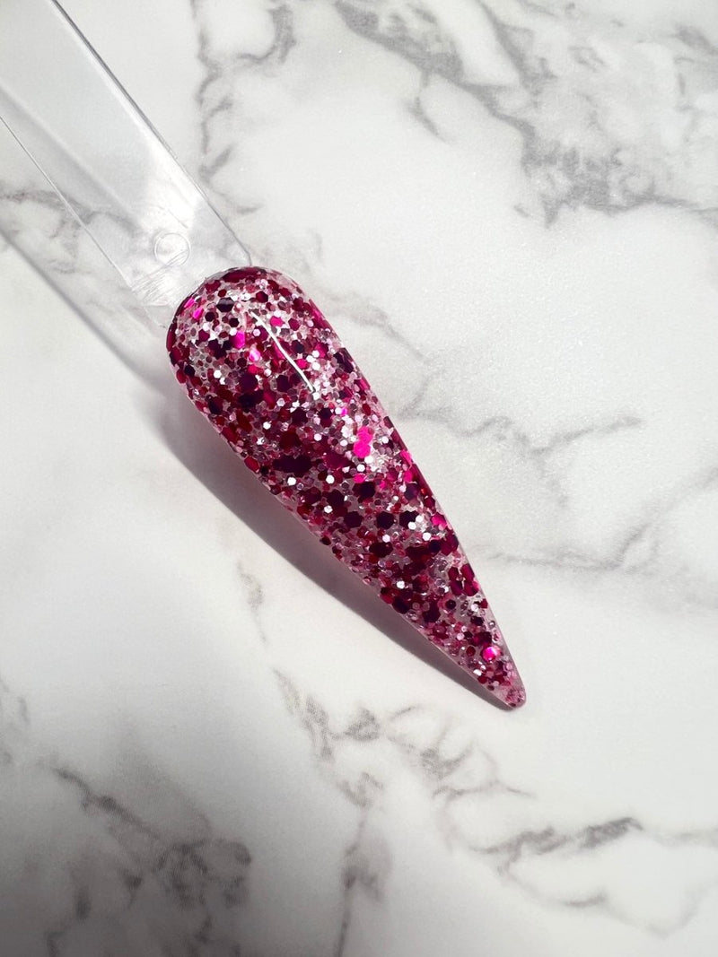 Photo shows swatch of Dipnotic Nails Love Language Pink Glitter Dip Powder The Love Struck Collection