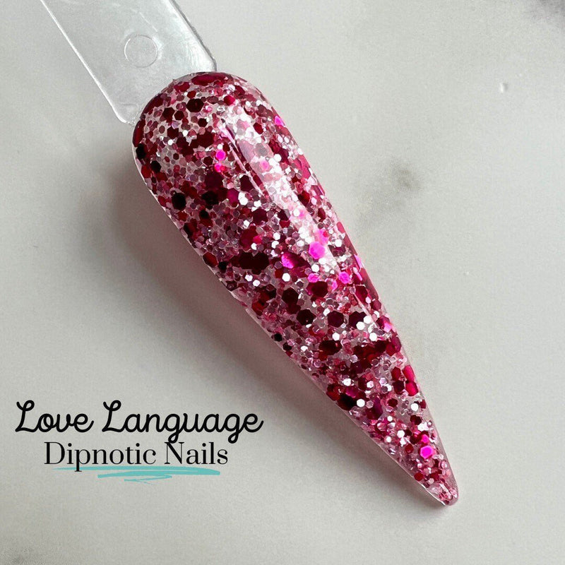 Photo shows swatch of Dipnotic Nails Love Language Pink Glitter Dip Powder The Love Struck Collection
