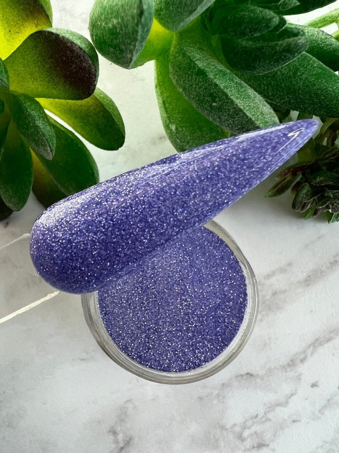 Photo shows swatch of Dipnotic Nails Luxe Purple Nail Dip Powder