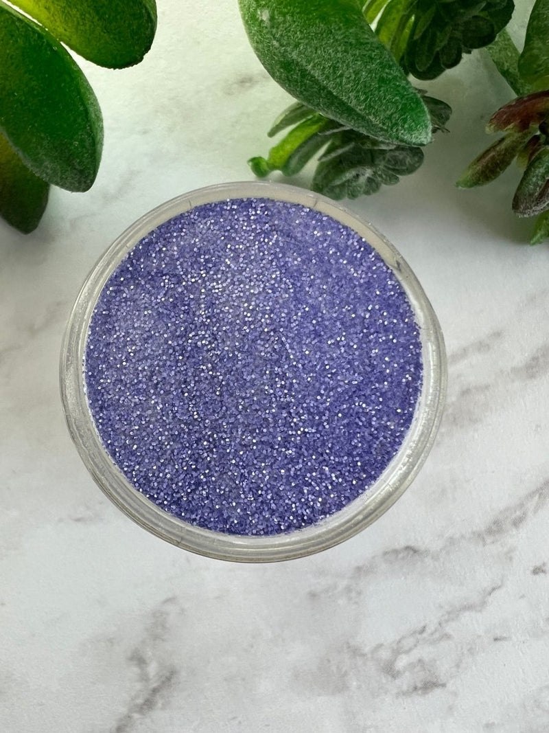 Photo shows swatch of Dipnotic Nails Luxe Purple Nail Dip Powder