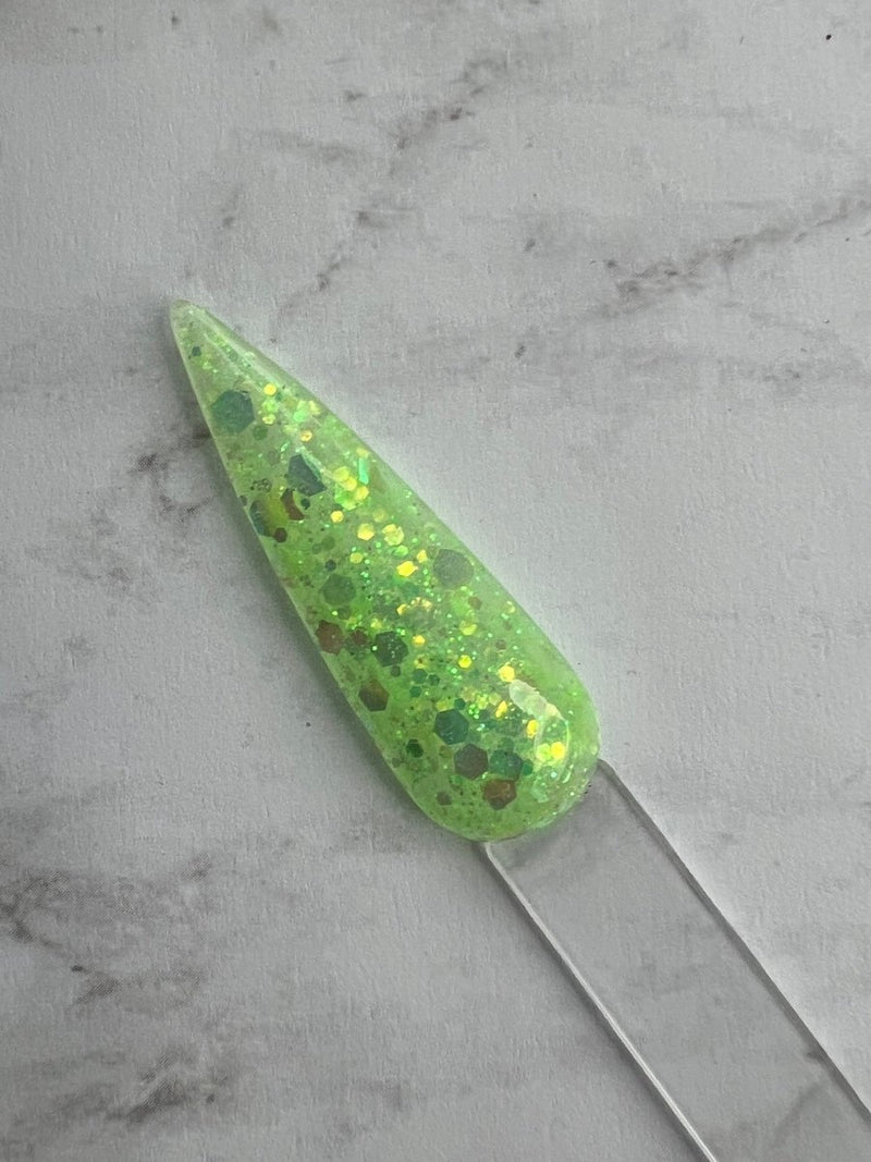 Photo shows swatch of Dipnotic Nails Margarita Neon Green Nail Dip Powder