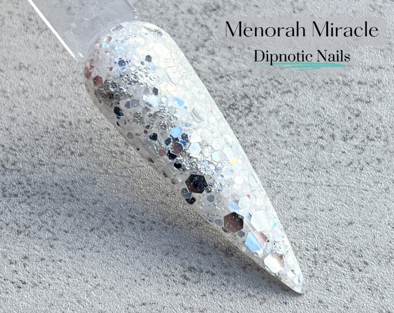 Photo shows swatch of Dipnotic Nails Menorah Miracle White and Silver Hanukkah Nail Dip Powder Latkes and Light Collection