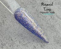 Photo shows swatch of Dipnotic Nails Mermaid Tears Periwinkle Dip Powder- The Enchanted Waters Collection