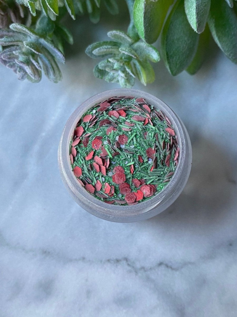 Photo shows swatch of Dipnotic Nails Mistletoe Christmas Red and Green Christmas Nail Dip Powder