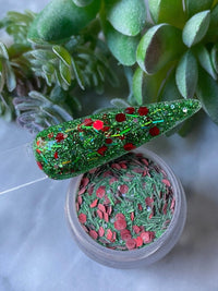 Photo shows swatch of Dipnotic Nails Mistletoe Christmas Red and Green Christmas Nail Dip Powder