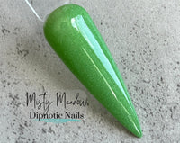Photo shows swatch of Dipnotic Nails Misty Meadow Green Nail Dip Powder The Emerald Isle Collection