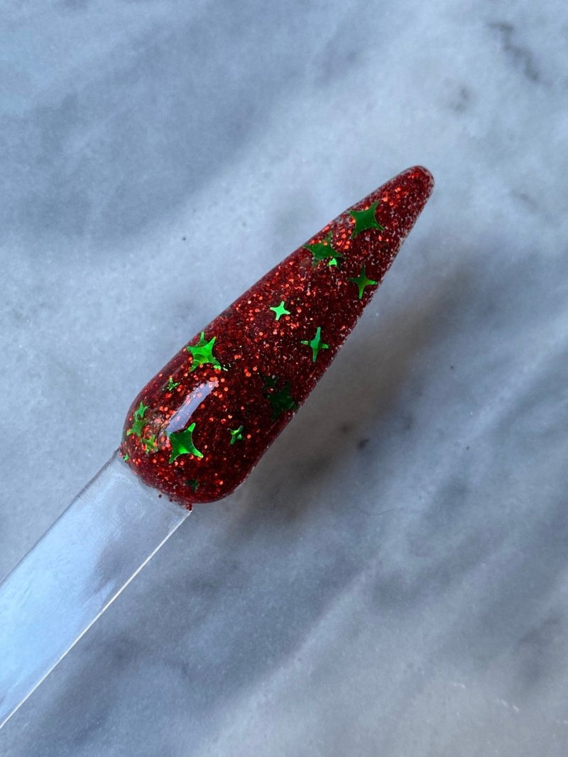Photo shows swatch of Dipnotic Nails Naughty Red and Green Christmas Nail Dip Powder