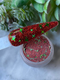 Photo shows swatch of Dipnotic Nails Naughty Red and Green Christmas Nail Dip Powder